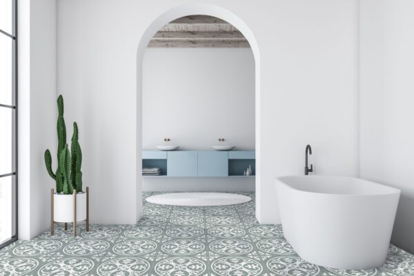Interior of modern bathroom with white walls, tiled floor, white bathtub and double sink on blue countertop in background. 3d rendering