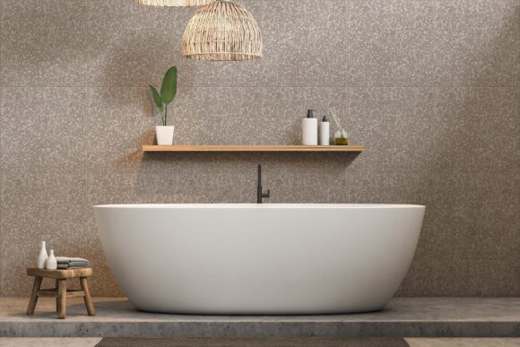 Minimalistic bathroom interior with white walls, concrete floor, white bathtub with shelf for shampoo and cream above it. 3d rendering
